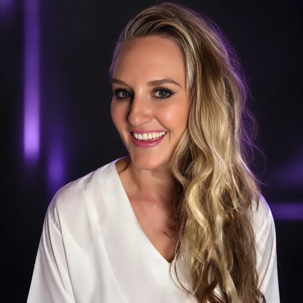 Melissa Mitchell in a black and purple technology setting
